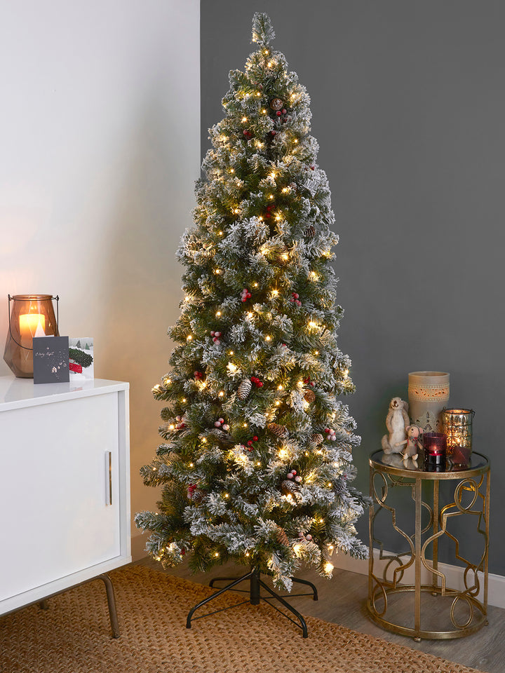 Bring snowy beauty into your home with a 6ft Slim Windsor Pre Lit Christmas Tree.