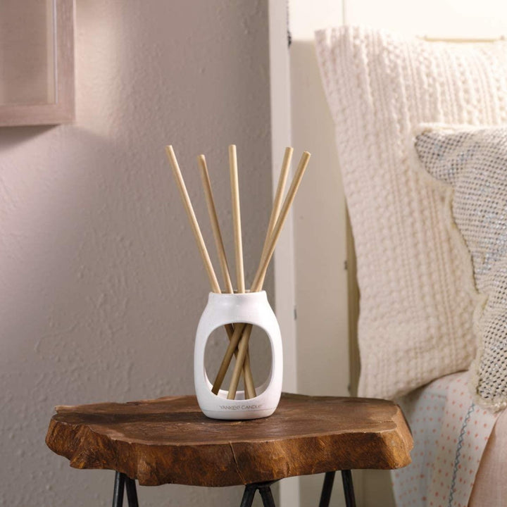 Elevate your ambiance with these pre-scented reed diffuser sticks, including vanilla, midnight jasmine, and clean cotton.
