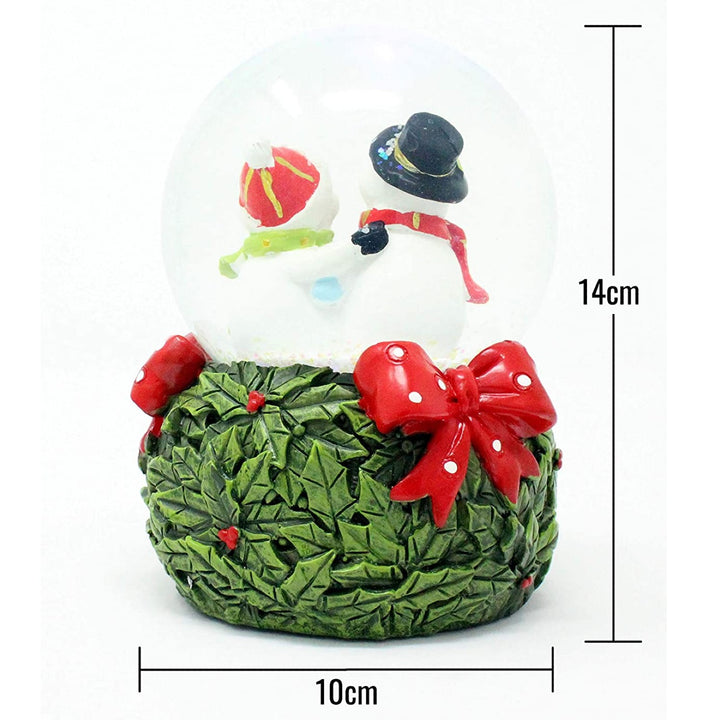 Celebrate the joy of winter with the heartwarming scene inside this Mr & Mrs Snowman snow globe.