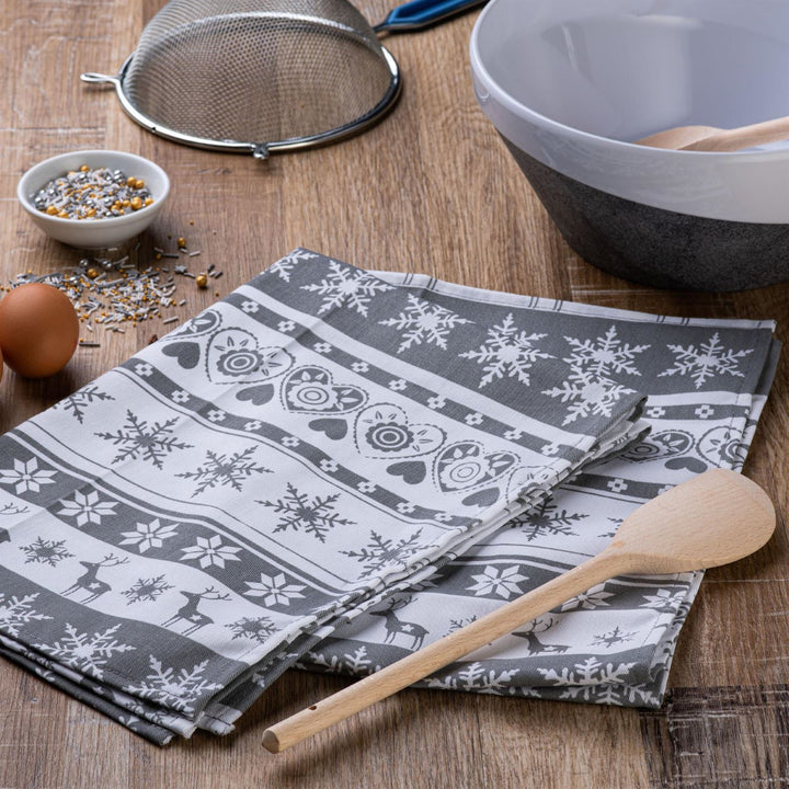 A stylish chef's apron with a Nordic reindeer design by Celebright.