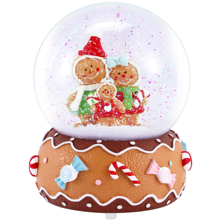 Festive Glass Snow Globe featuring a heartwarming Gingerbread Family scene, illuminated by vibrant LEDs and powered by batteries. Perfect holiday decoration.