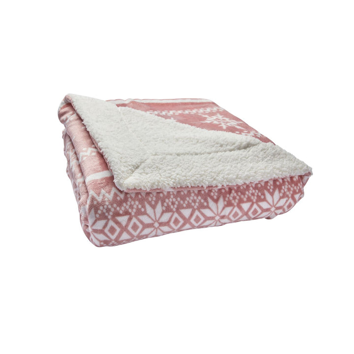 A blush Nordic Celebright Sherpa Blanket, sized 130x180cm, inviting warmth and comfort for tranquil evenings.