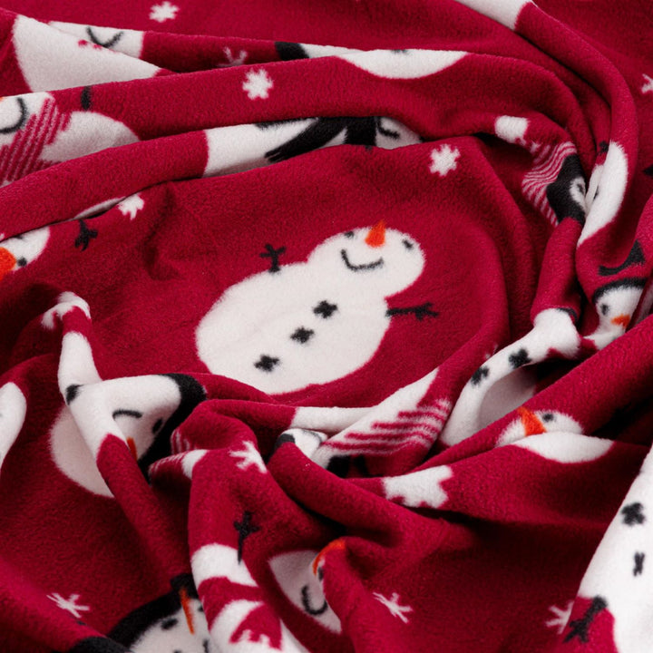 A warm and inviting Christmas-themed fleece throw in Snowman Red, perfect for adding holiday charm to your decor.