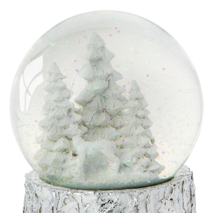 Experience the enchantment of the season with this White Christmas Tree Snow Globe.