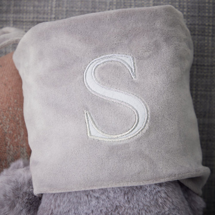 Light grey stockings personalized with monogrammed letters, 50cm tall and 27cm wide, made from luxurious 100% polyester fabric, adding a custom touch to your festive decor.