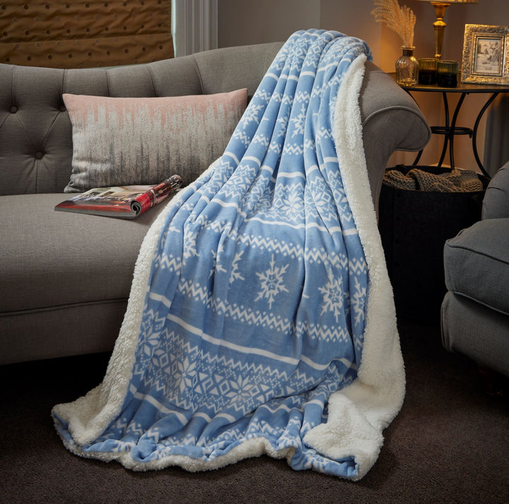 A chic denim Nordic Denim Sherpa blanket, 130x180cm in size, inviting you to snuggle up and stay warm in style.