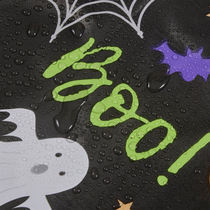 Night-themed PVC tablecloths featuring crescent moons, owls, and spooky silhouettes, setting the scene for a Halloween bash.