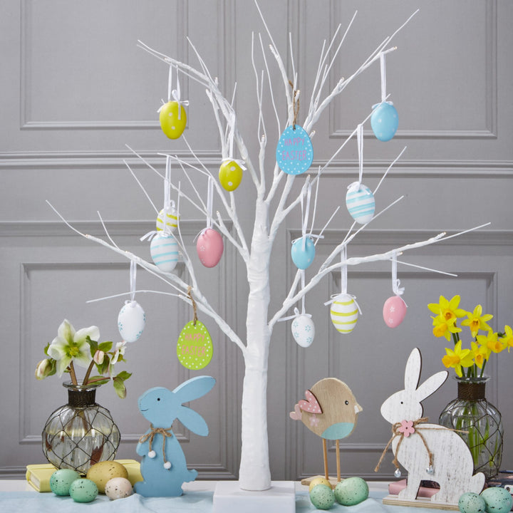 A 2ft white Easter tree adorned with warm white lights, creating a festive ambiance.