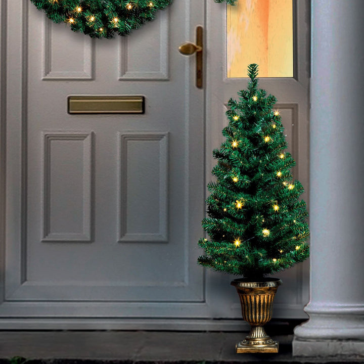 A pair of pre-lit 3ft Christmas trees in stylish decorative pots.