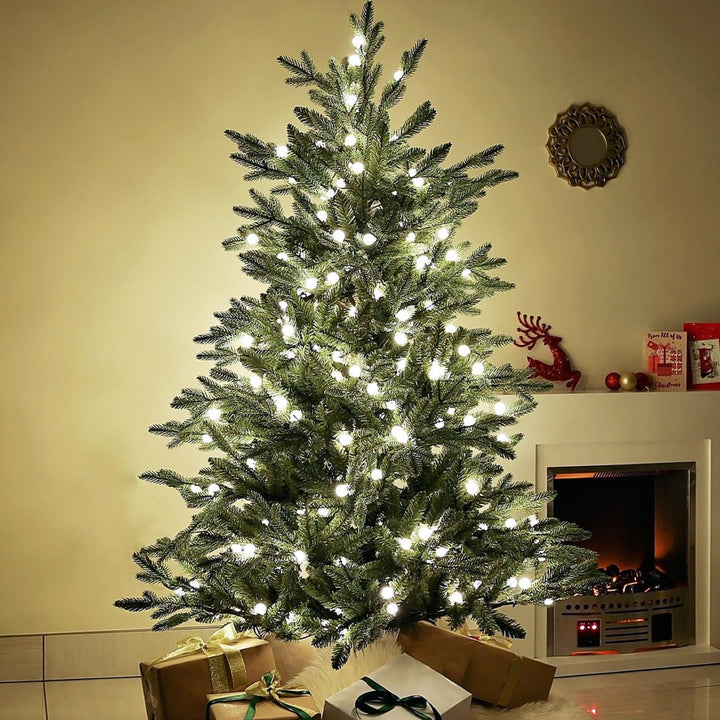 A 6ft Finland Fir Christmas tree with a touch of elegance, aglow in the soft radiance of warm white lights, perfect for your holiday celebrations.
