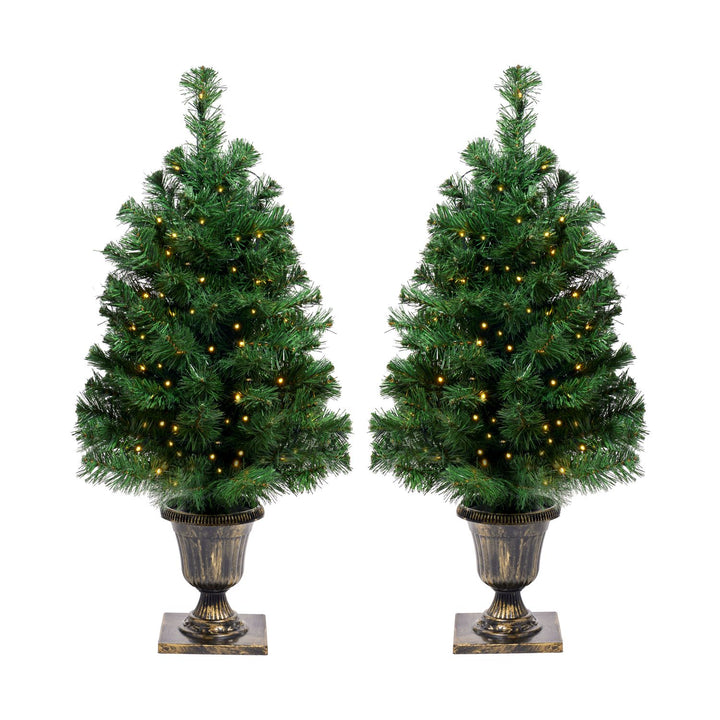 Two beautifully adorned 3ft Christmas trees glowing with warm lights, nestled in ornate pots, ready to bring festive cheer to your home.