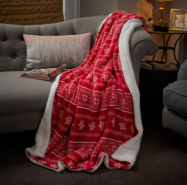 A stylish 130x180cm red Nordic Sherpa blanket from Celebright, neatly folded and displayed, evoking a feeling of warmth and luxury.