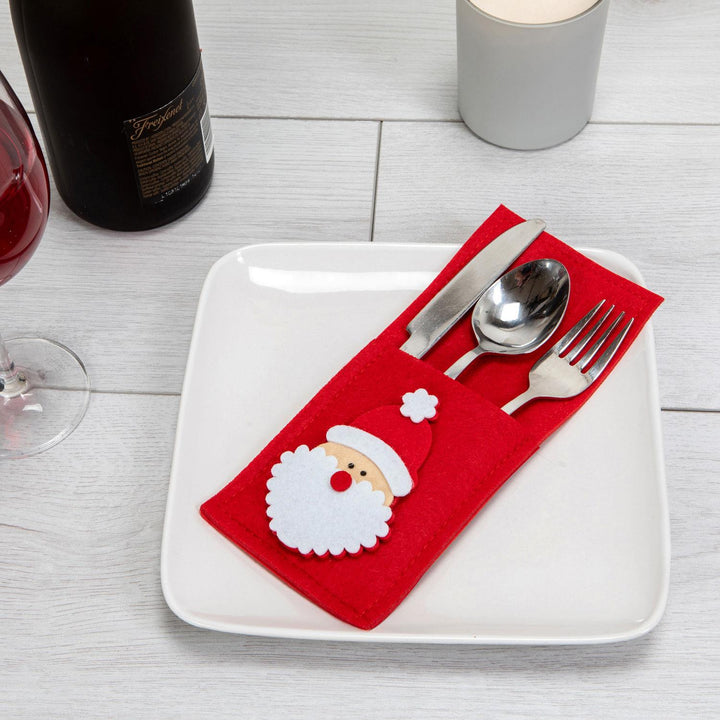 Premium felt cutlery holders with a sharp Santa Claus cut-out design, adding elegance and charm to your festive dinner table.