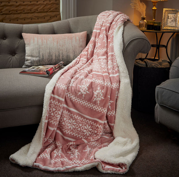 A 130x180cm Celebright Sherpa Blanket in elegant blush Nordic hue, promising indulgent softness and supreme cosiness.
