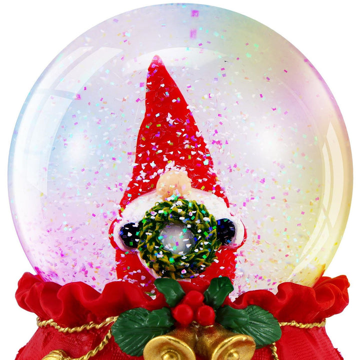 Close-up of a Christmas Musical Snowglobe featuring Gonk with a Wreath, illuminated by LED lights, and playing cheerful holiday tunes.