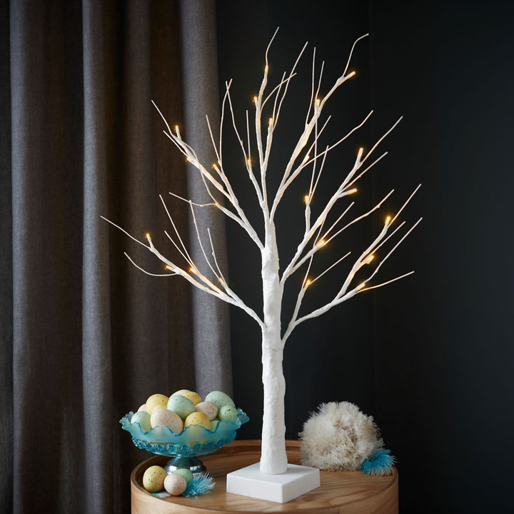 A 2ft white Easter tree featuring warm white lights, ideal as a centerpiece for your holiday gatherings.