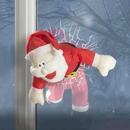 A dynamic Christmas window exhibit showcasing a crashing Santa Claus.