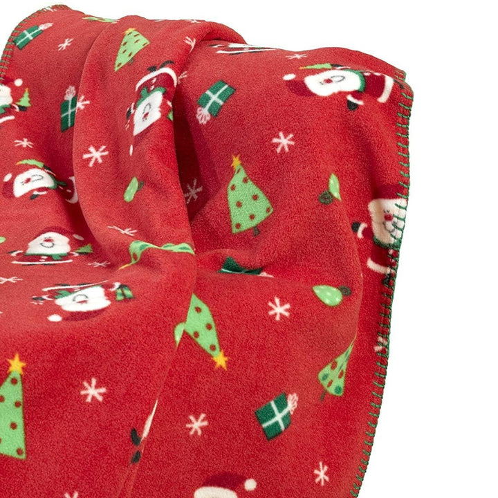 A 127x152cm Christmas fleece throw featuring a Santa Claus pattern, adding warmth and charm to your holiday season.