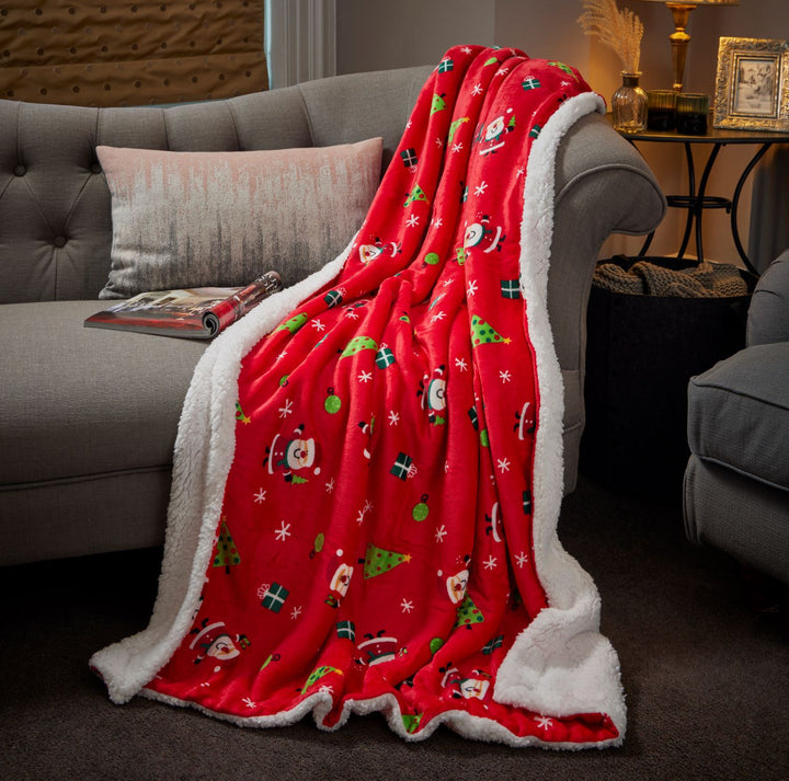 Experience warmth and holiday cheer with our 130x180cm Celebright Sherpa blanket adorned with a charming Santa design.
