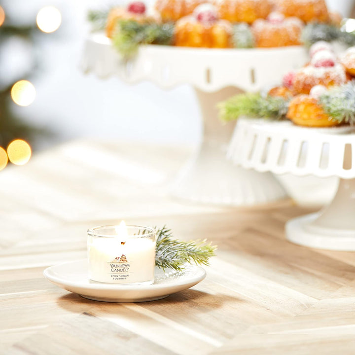 A trio of Yankee Candle votives filled with the inviting aroma of Sugar Spun Flurries, perfect for the holiday season.