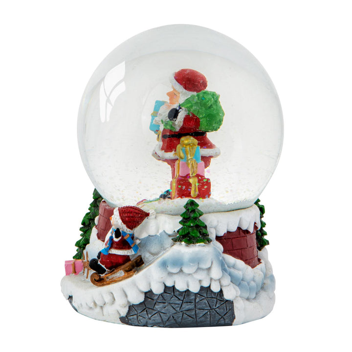 Let the Santa & Child Sledging musical snow globe fill your home with the holiday spirit.