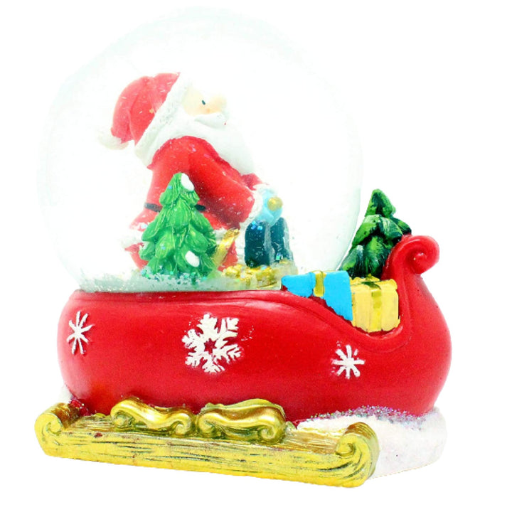 Let the Santa & Child Sledging musical snow globe fill your home with the holiday spirit.