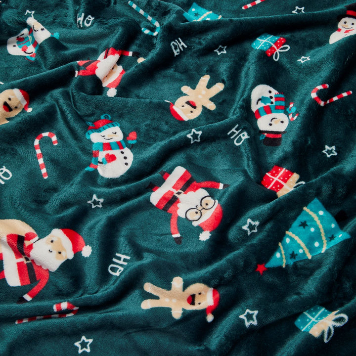 Holiday-themed green fleece throw, 50x60in, made entirely from recycled plastic bottles. Cozy and eco-friendly.