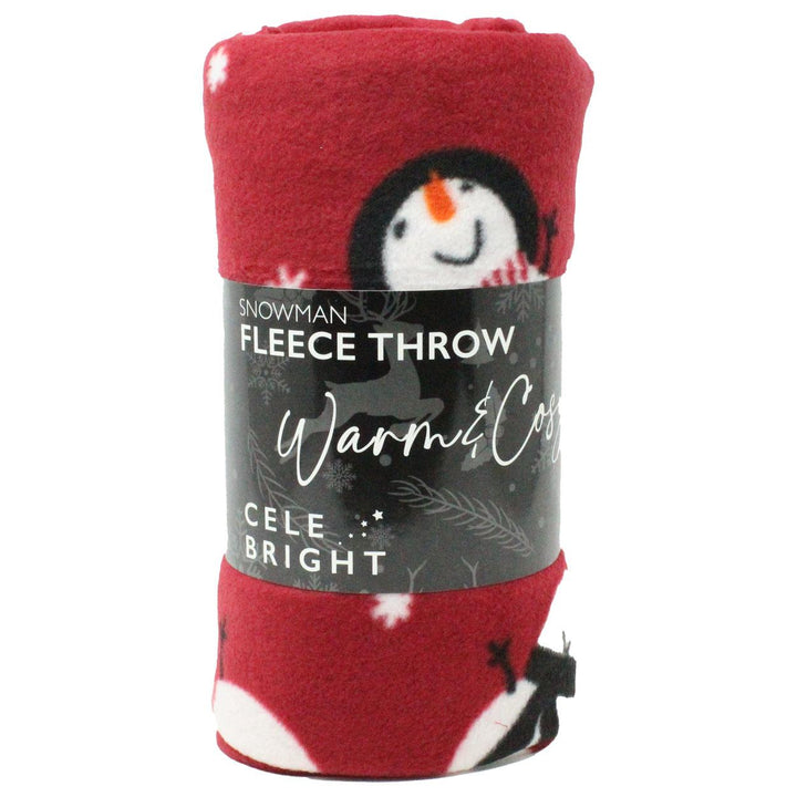A Snowman Red Christmas-themed fleece throw draped over a couch, creating a cozy and festive atmosphere in your living room.