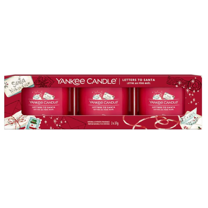 A delightful arrangement of three Yankee Candle filled votives adorned with festive 'Letters to Santa' labels, capturing the spirit of holiday magic and anticipation.