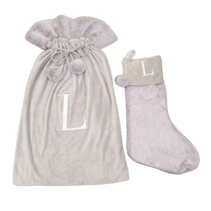 Indulge in sophistication with these Light Grey Luxury Sacks & Stockings featuring an exquisite Monogrammed Letter L. Elevate your holiday decor with these elegant, personalized stockings, adding a touch of charm and class to your festive celebrations.