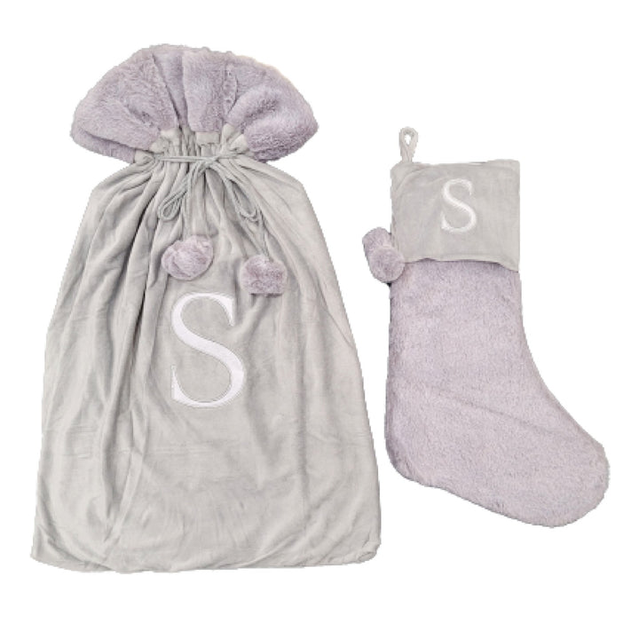 Chic light grey stockings with an embroidered Monogrammed Letter S, ideal for sophisticated holiday décor. These premium sacks exude elegance and style.