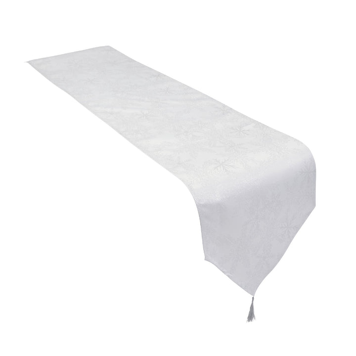 Shimmering snowflake table runner in white and silver, 13x96 inches.