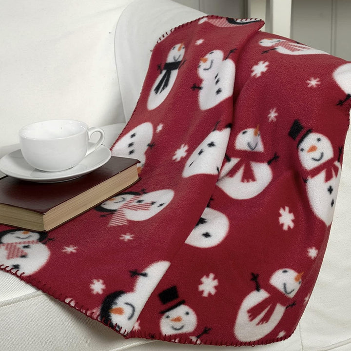A high-quality Snowman Red fleece throw with delightful snowman designs, perfect for enhancing your holiday home decor.