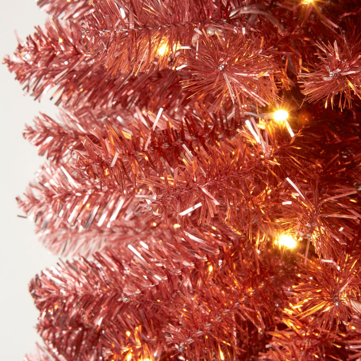 Experience modern festive charm with a 6ft Rose Gold Pre Lit Pencil Christmas Tree.