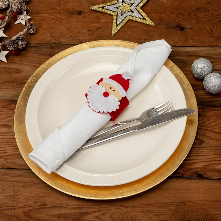 Set of 4 premium felt napkin rings featuring a sharp cut-out design of Santa Claus, providing a touch of sophistication to your Christmas table decor.