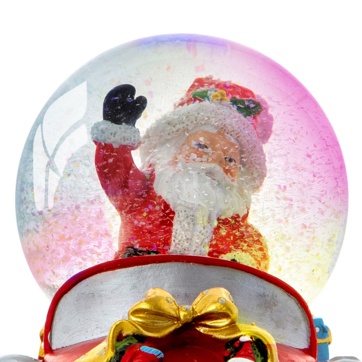 Enhance your holiday ambiance with a decorative snow globe featuring Santa Claus in a car.