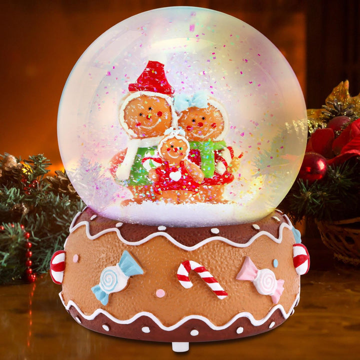 Captivating snowfall effect inside the Gingerbread Family Snowglobe. Watch snowflakes descend gracefully, adding a touch of winter magic to your holiday display.