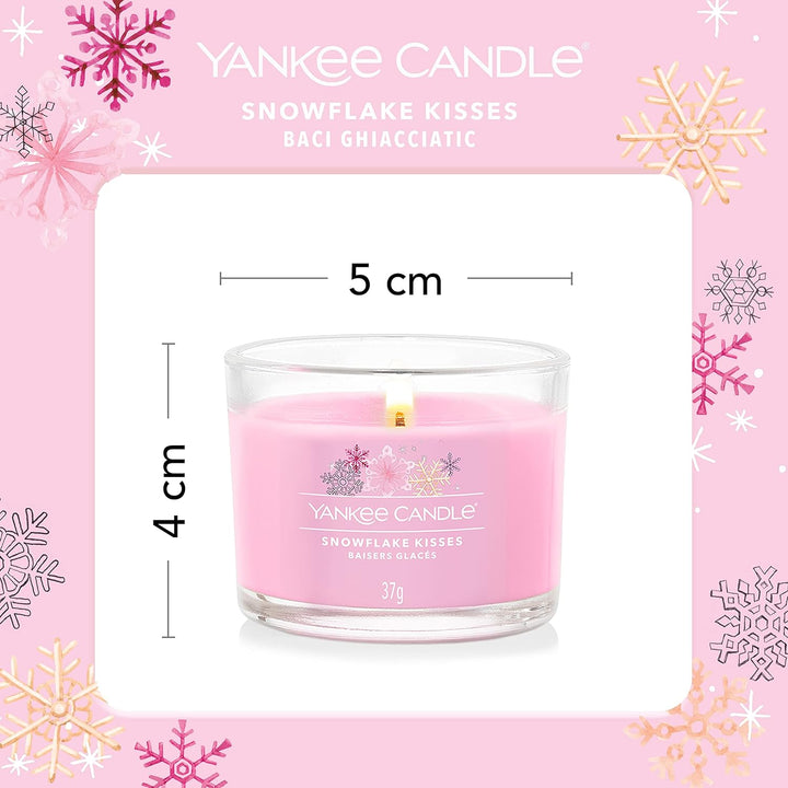 Limited edition Snowflake Kisses Yankee Candle votives, embracing the essence of winter, featuring snowflake accents, delivering a warm and comforting fragrance experience.