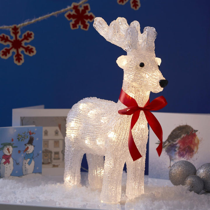 Sparkling acrylic reindeer holiday decoration.