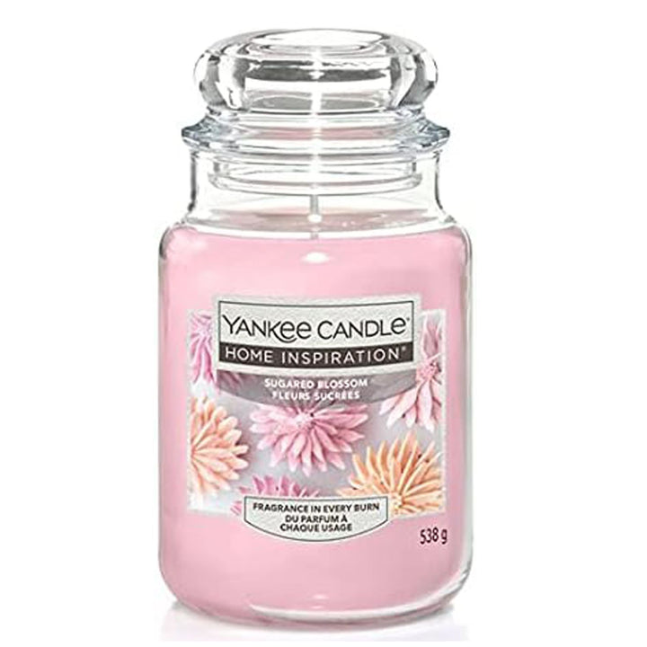 A large jar of Sugared Blossom fragrance, part of a relaxing gift set.