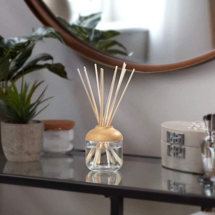 Experience the essence of a bright and cheerful meadow with the Sunny Day Dream Scented Reed Diffuser by Yankee Candle, enhancing your home with its captivating scent.