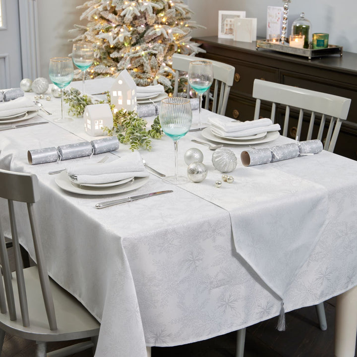 Large 52x90 inches tablecloth in white and silver, evoking a winter wonderland feel.