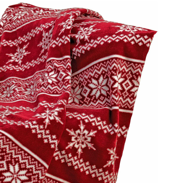 A red and white Christmas fleece throw measuring 127 x 152cm, ideal for snuggling up and staying stylish during the holidays.