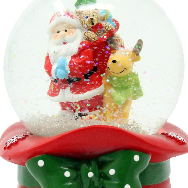 Add a touch of whimsy to your holiday decor with this Santa & Rudolph snow globe.