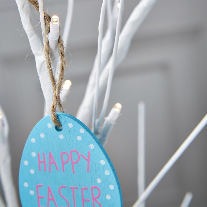 A 2ft Easter tree in white, softly lit with warm white lights for a cozy Easter atmosphere.