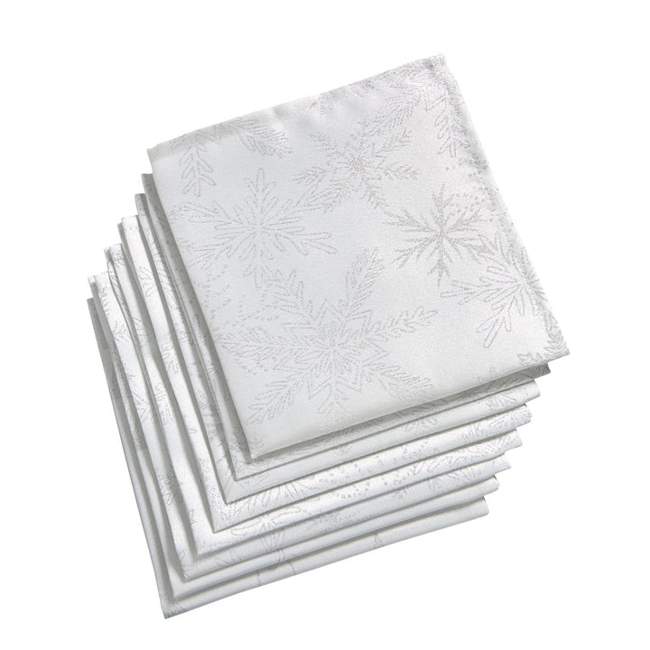 Set of 8 stylish white and silver snowflake napkins, enhancing your dining experience.