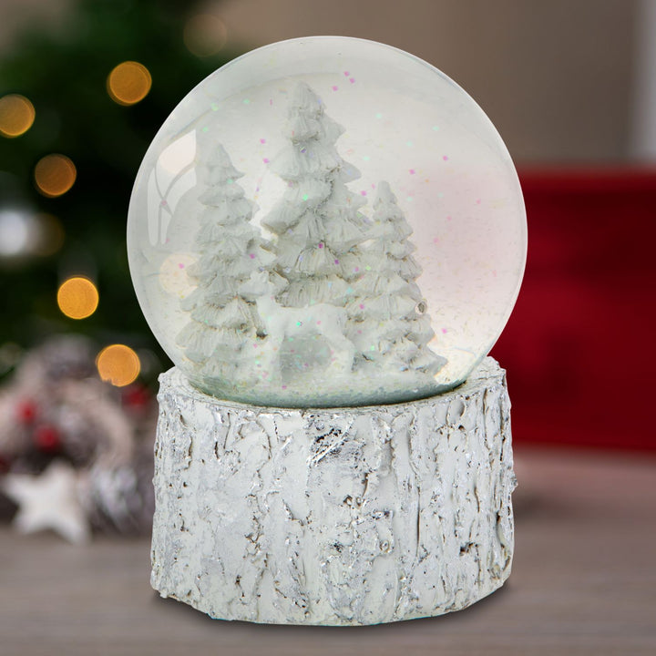 Wind it up and let the magic play: A delightful White Christmas Tree Musical Snow Globe.