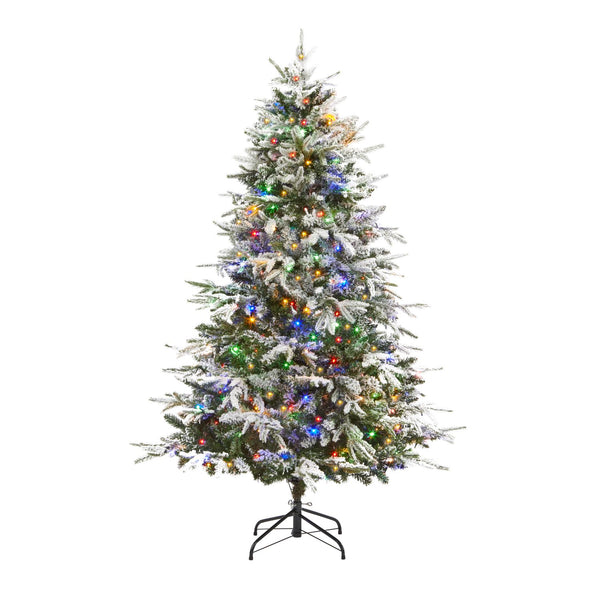 A magical winter wonderland scene featuring a 6ft flocked pine Christmas tree with a mix of warm white and multicolored lights, evoking the spirit of the season.