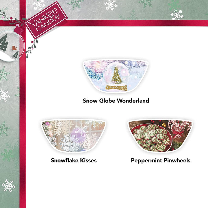A Yankee Candle gift set featuring scents of Frosted Evergreen, Spiced Cranberry, and Vanilla Snowflake wax melts.