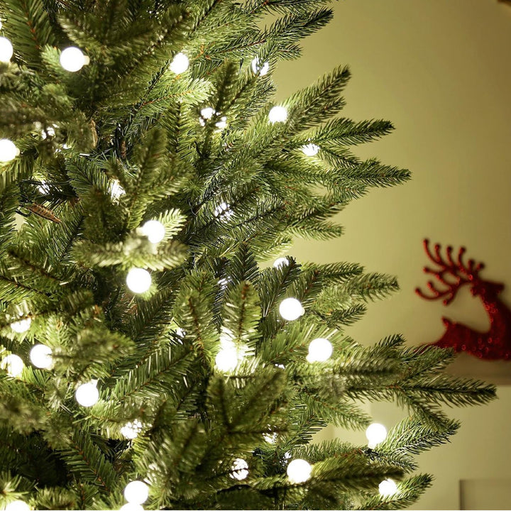 Transform your home into a winter wonderland with a 6ft Finland Fir Christmas tree bathed in the gentle warmth of white LED lights.
